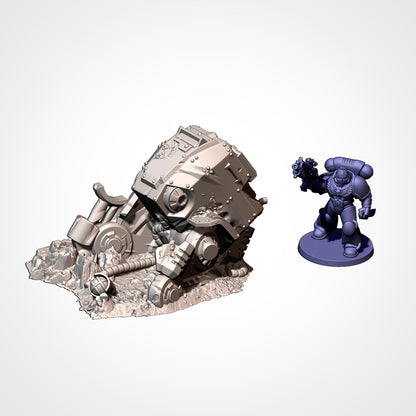 Walker 1: view beside a 32mm figure, walker wreck nose-down in the rubble, legs folded behind it (Txarli Factory render).