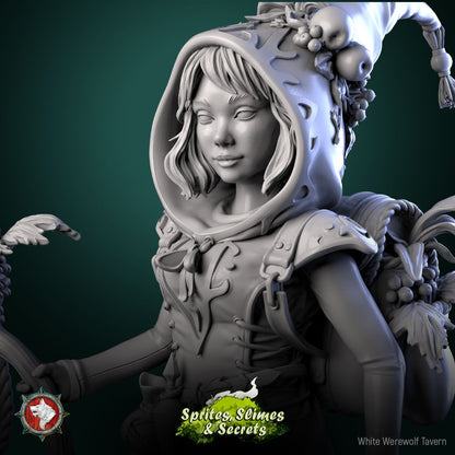 Render of Thimblefolk Display Model | 75mm Halfling Gleaner: Hooded halfling gleaner with sickle and flower basket, from White Werewolf's Sprites, Slimes and Secrets. 75mm 3D printed resin display model.