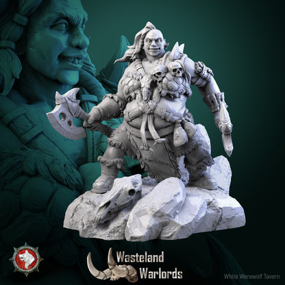 Bloody Bitbat resin miniature, hulking barbarian with axe and bladed arm on a rocky base with buflon skull