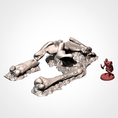 Dead giant mammoth bone scatter beside a 32mm miniature, scatter terrain.