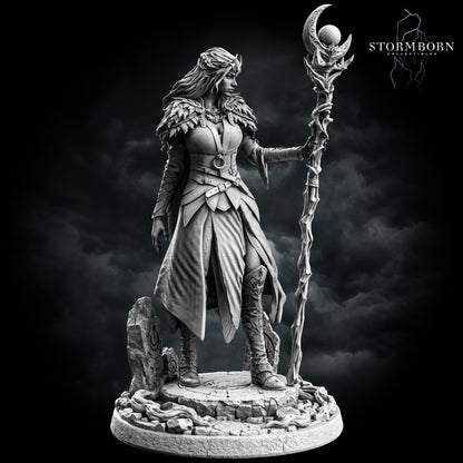 Maelin, Druid of the Moon, three-quarter view of the feathered mantle, layered robe and standing stones, resin display miniature by Stormborn Collectibles