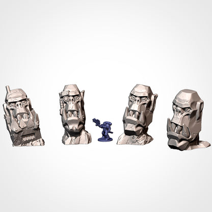 Orc Stone Heads 1 to 4: four tusked orc stone heads beside a 32mm figure (Txarli Factory render)