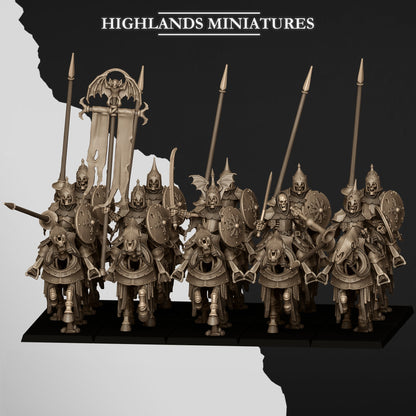 Undead Dark Knights unit charging in ranks behind the bat-winged banner, lances raised, on barded skeletal horses, front view; Highlands Miniatures render of the October 2026 updated release